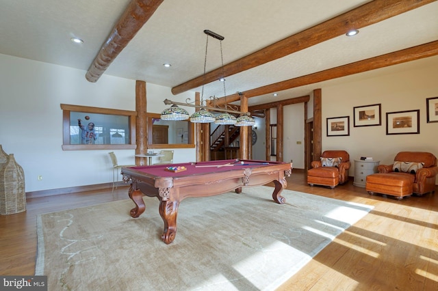 recreation room with beam ceiling, light hardwood / wood-style flooring, and pool table