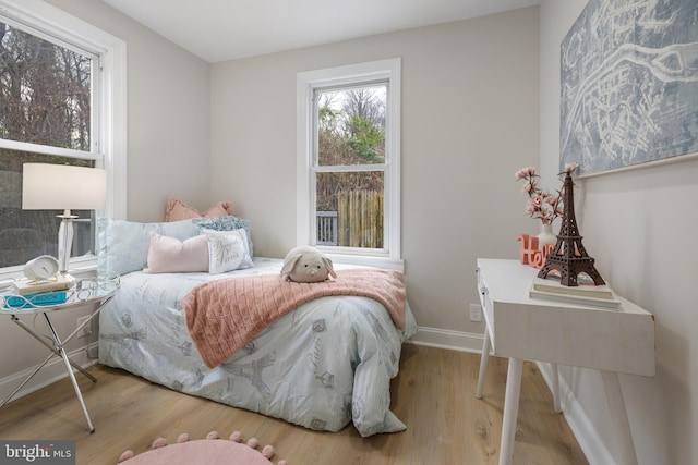 bedroom with hardwood / wood-style floors