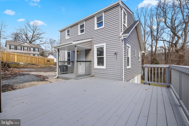 rear view of house with a wooden deck