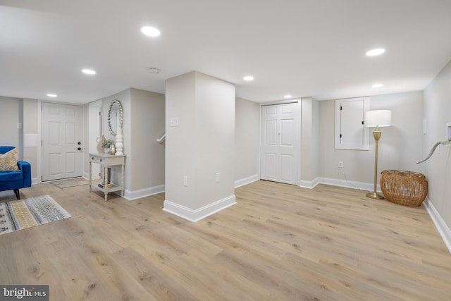 basement featuring light hardwood / wood-style flooring