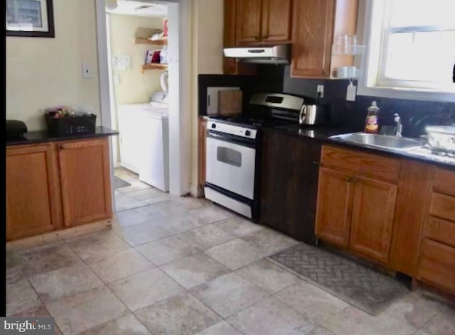 kitchen featuring light tile floors, white stove, sink, and range hood