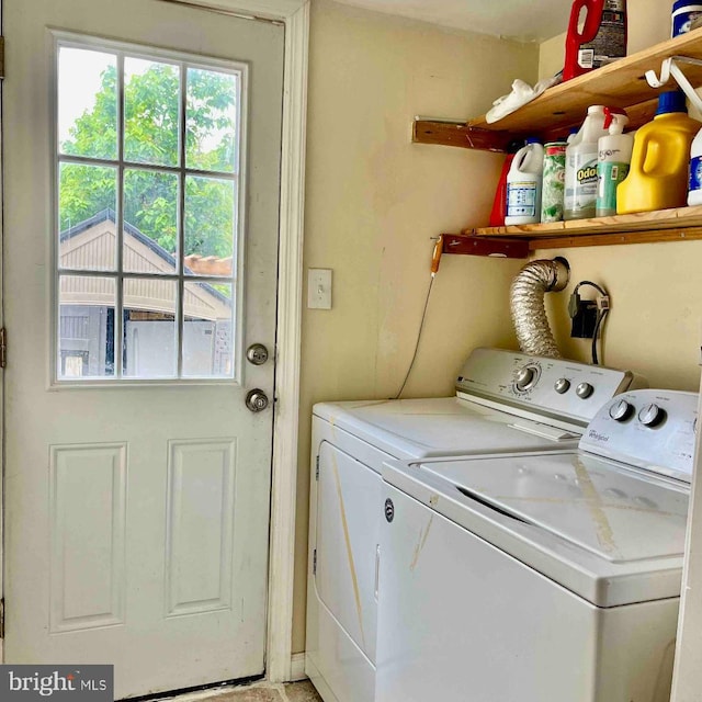 laundry area with washing machine and dryer