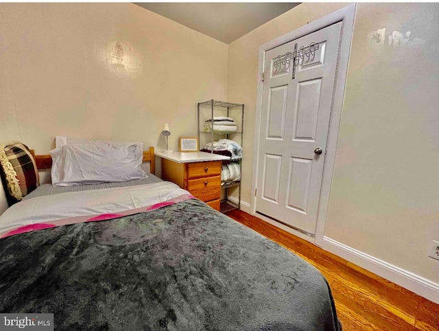 bedroom featuring dark wood-type flooring