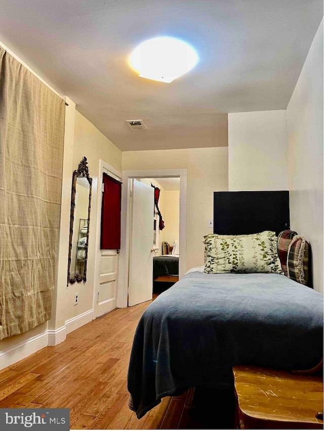 bedroom featuring light hardwood / wood-style floors