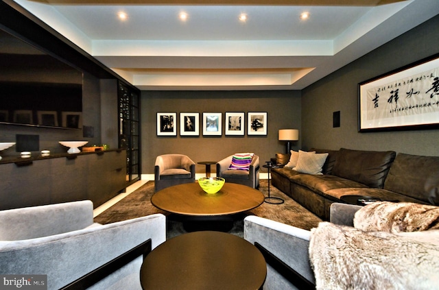 living room featuring a tray ceiling