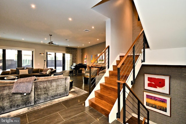 tiled living room with ceiling fan