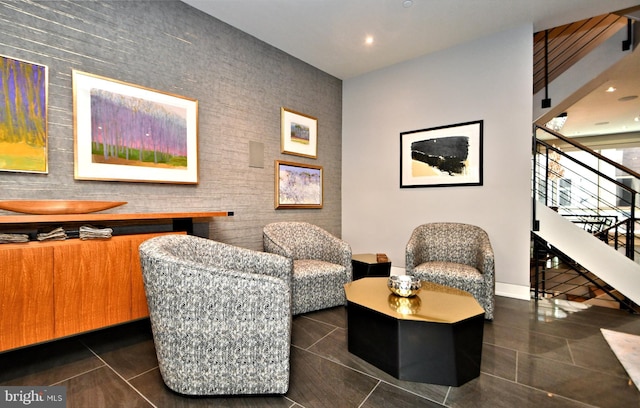 living area with dark tile patterned floors