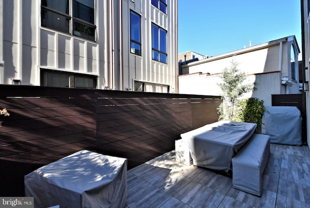 wooden deck featuring area for grilling