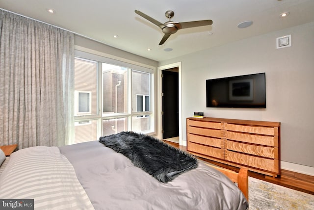 bedroom featuring hardwood / wood-style flooring and ceiling fan