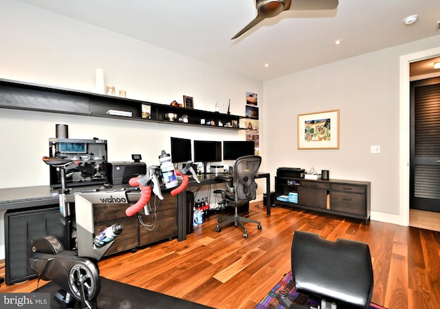 office area with wood-type flooring and ceiling fan