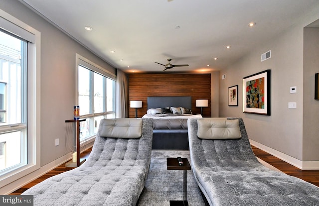 bedroom with ceiling fan and dark wood-type flooring