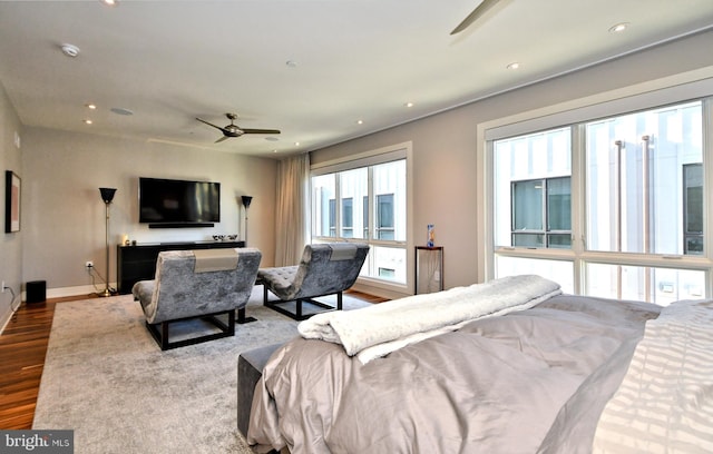 bedroom featuring wood-type flooring and ceiling fan