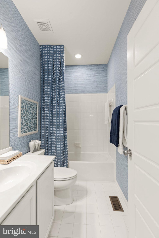 bathroom featuring vanity, tile patterned floors, toilet, and visible vents