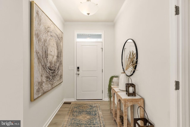 entryway featuring light wood-type flooring, baseboards, and ornamental molding