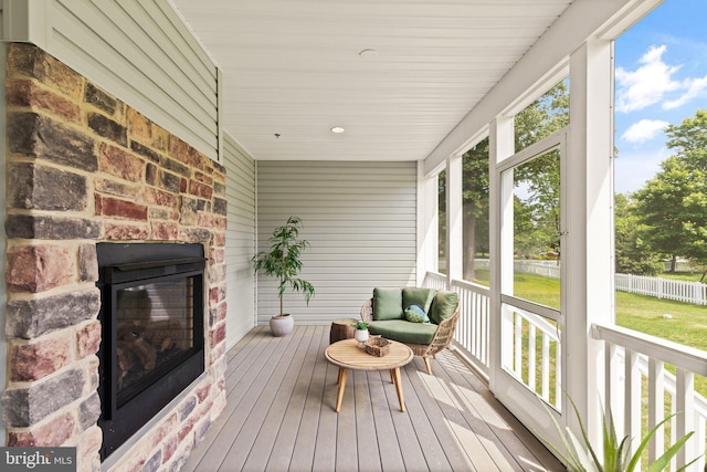 sunroom with a fireplace