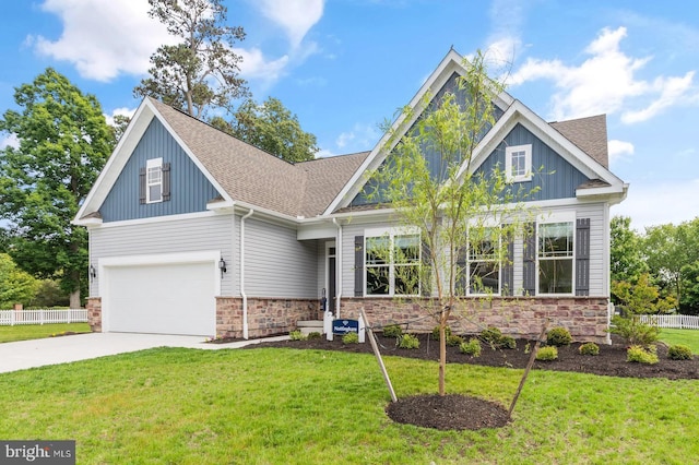 craftsman-style house featuring stone siding, an attached garage, a front lawn, and fence