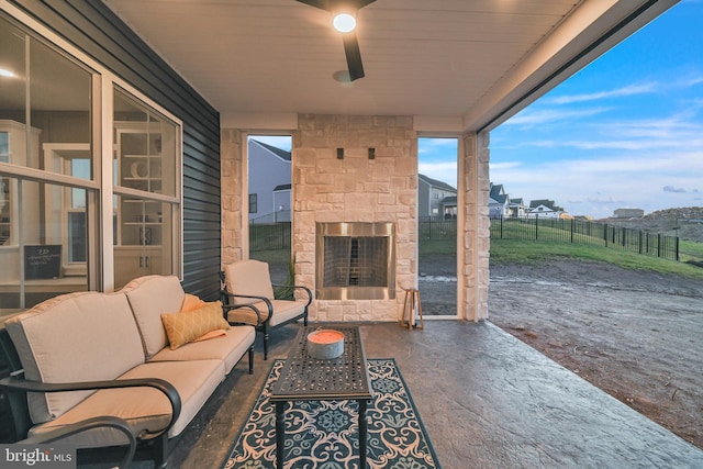 view of patio / terrace featuring an outdoor living space with a fireplace