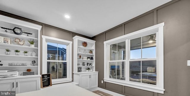 interior space with hardwood / wood-style flooring and built in features