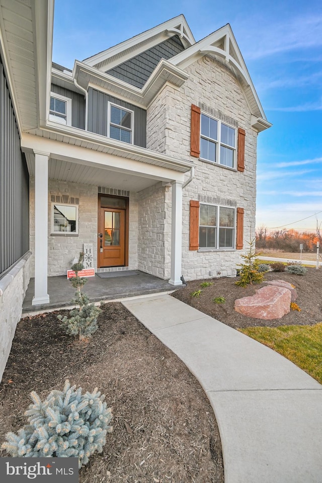 entrance to property featuring a porch