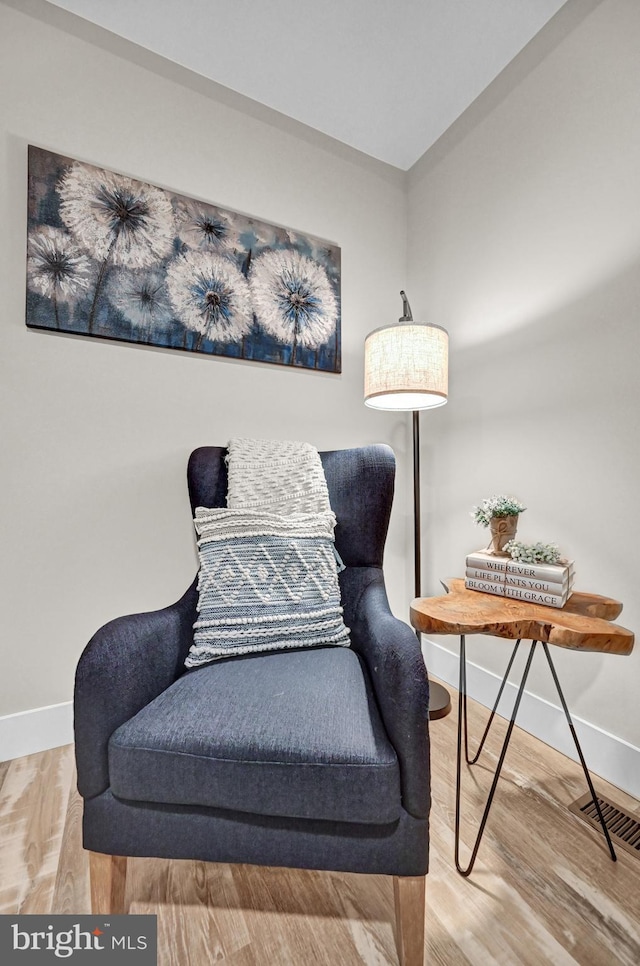 sitting room featuring wood-type flooring