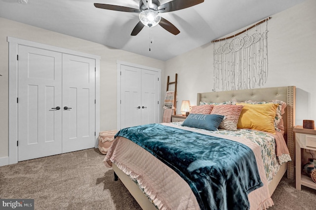 bedroom with multiple closets, ceiling fan, and carpet floors