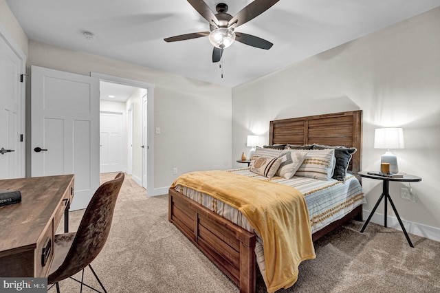 bedroom featuring ceiling fan and light colored carpet