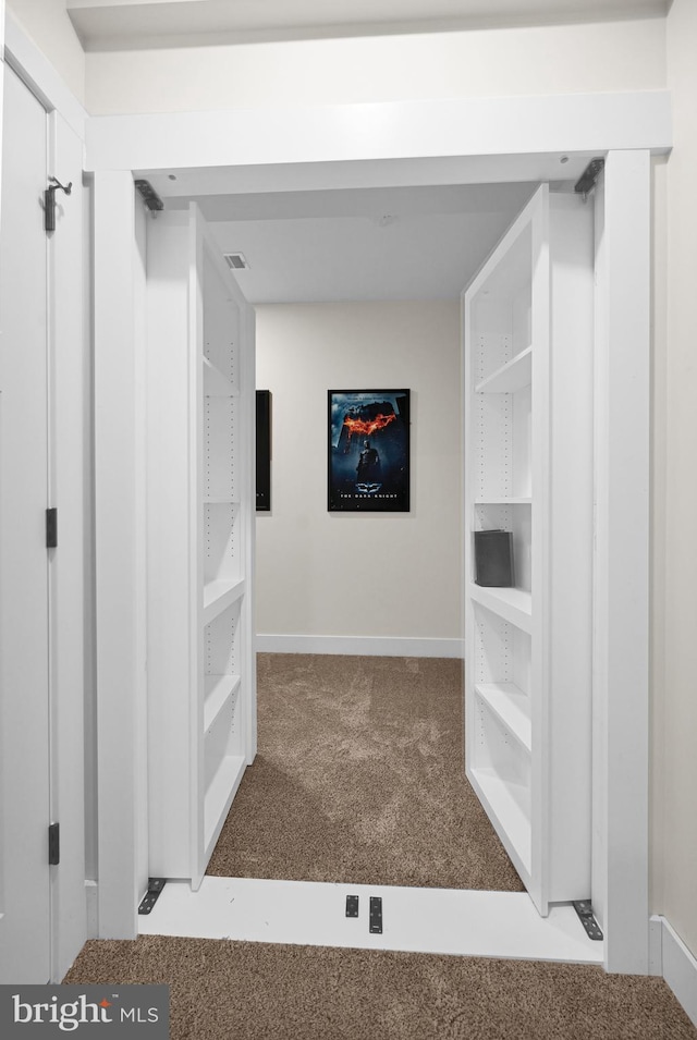 corridor with carpet flooring