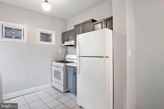 kitchen featuring white appliances, gray cabinetry, and light tile patterned flooring