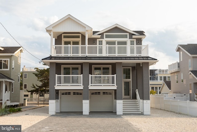 beach home with a balcony and a garage