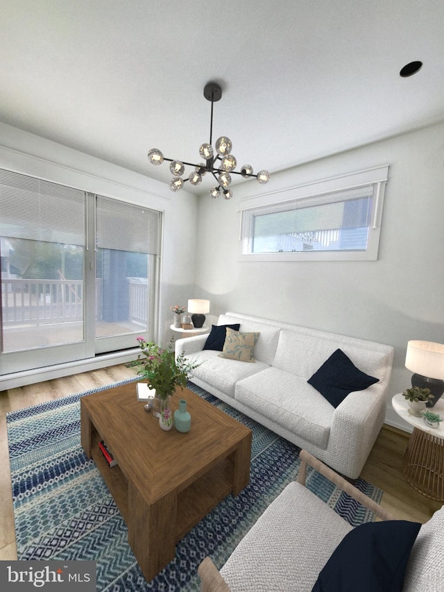 living room featuring hardwood / wood-style flooring and a chandelier