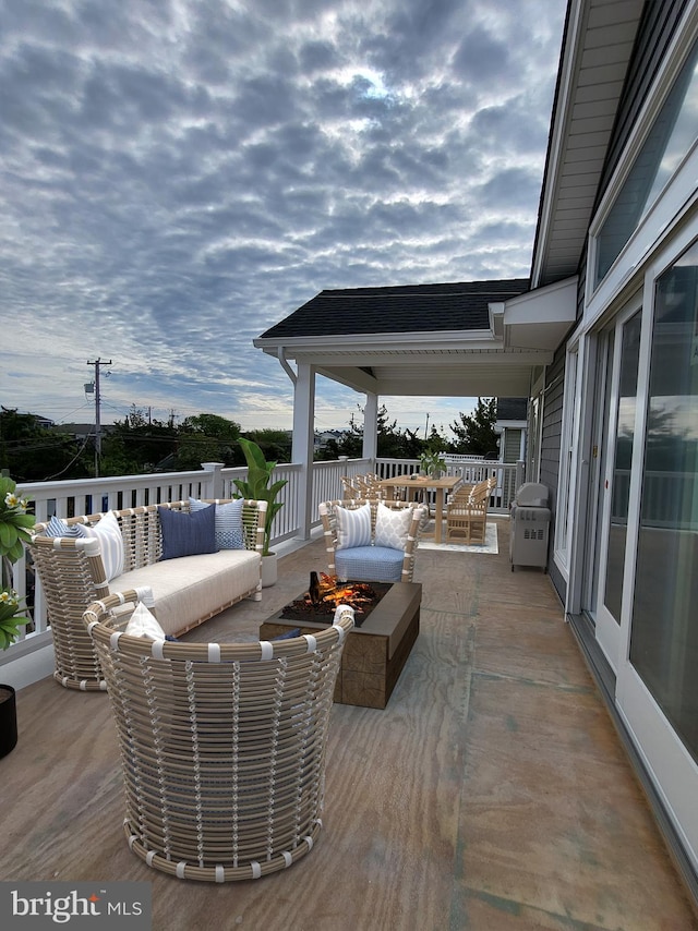 deck featuring an outdoor living space and grilling area