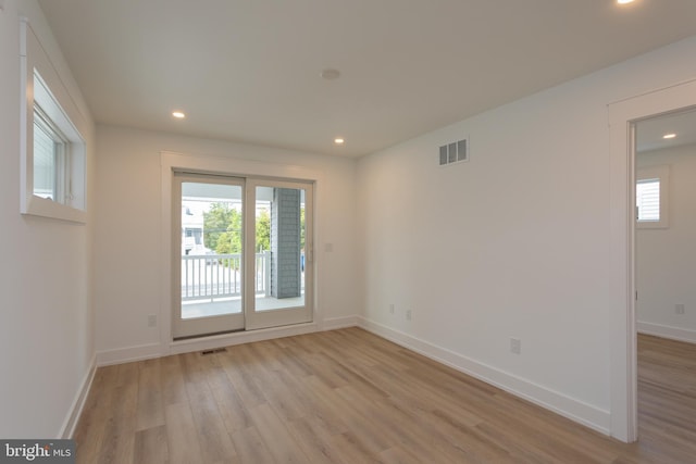 unfurnished room featuring light wood-type flooring