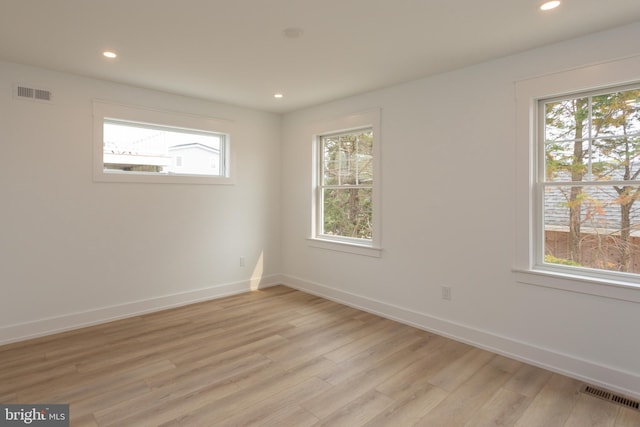 unfurnished room featuring light hardwood / wood-style flooring