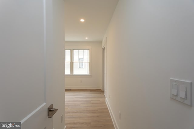 hallway with light wood-type flooring