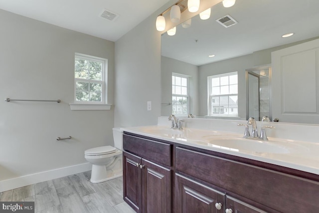 bathroom featuring hardwood / wood-style floors, vanity, and toilet