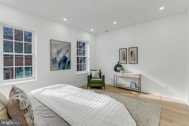 bedroom with light hardwood / wood-style flooring