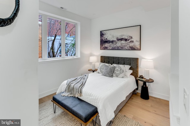 bedroom featuring light wood-type flooring