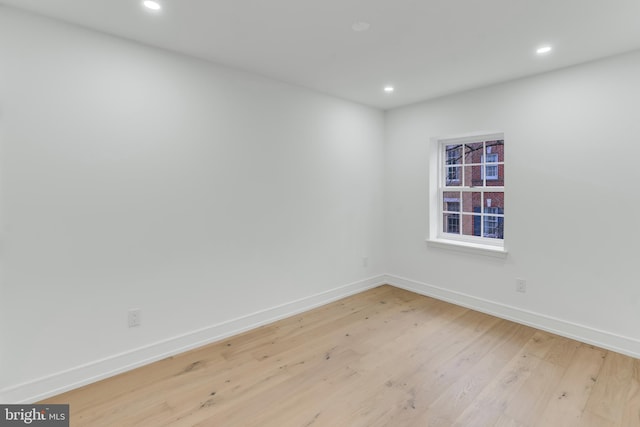 spare room with light wood-type flooring