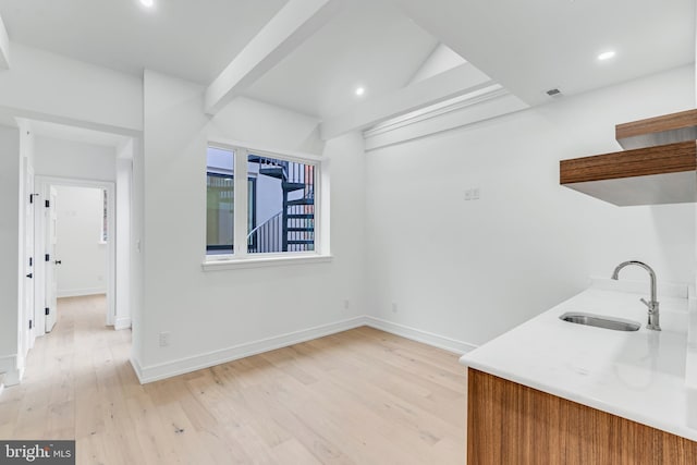 interior space featuring sink and light wood-type flooring