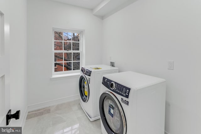 washroom with washer and clothes dryer