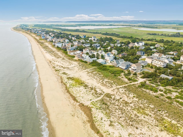 aerial view featuring a water view and a beach view