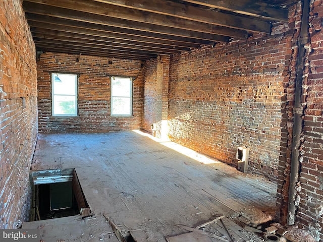 misc room with brick wall