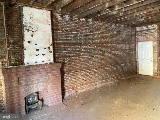 interior space featuring brick wall