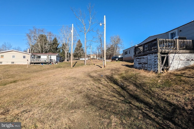 view of yard featuring a deck