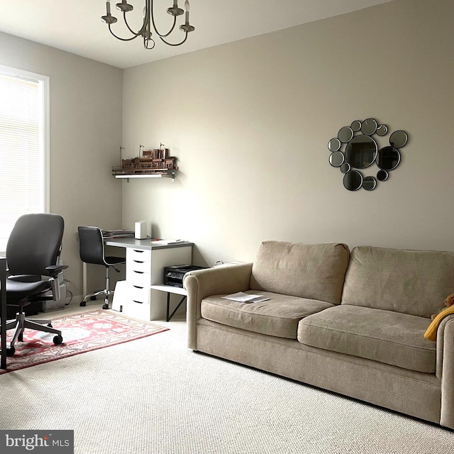 office area featuring a chandelier and carpet floors