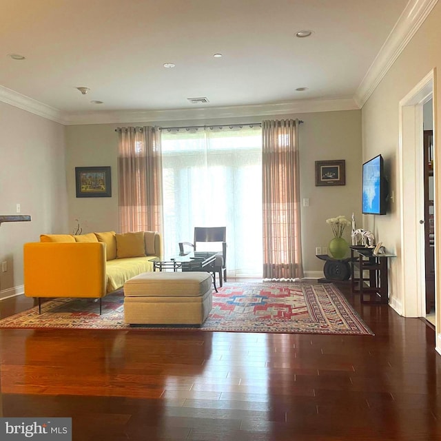 living room with hardwood / wood-style floors and ornamental molding