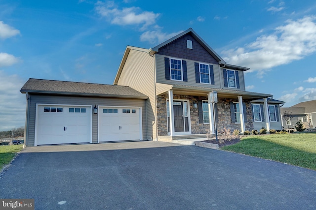 craftsman-style house with a front yard, a porch, and a garage