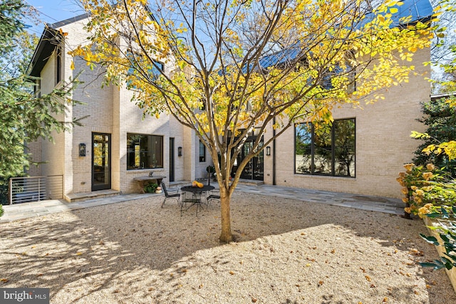 back of house with a patio area