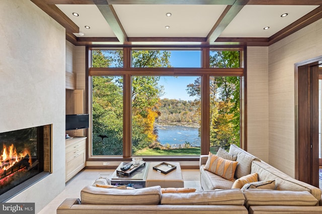 living room featuring coffered ceiling, a water view, and beam ceiling