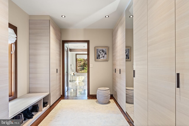 mudroom with tile walls